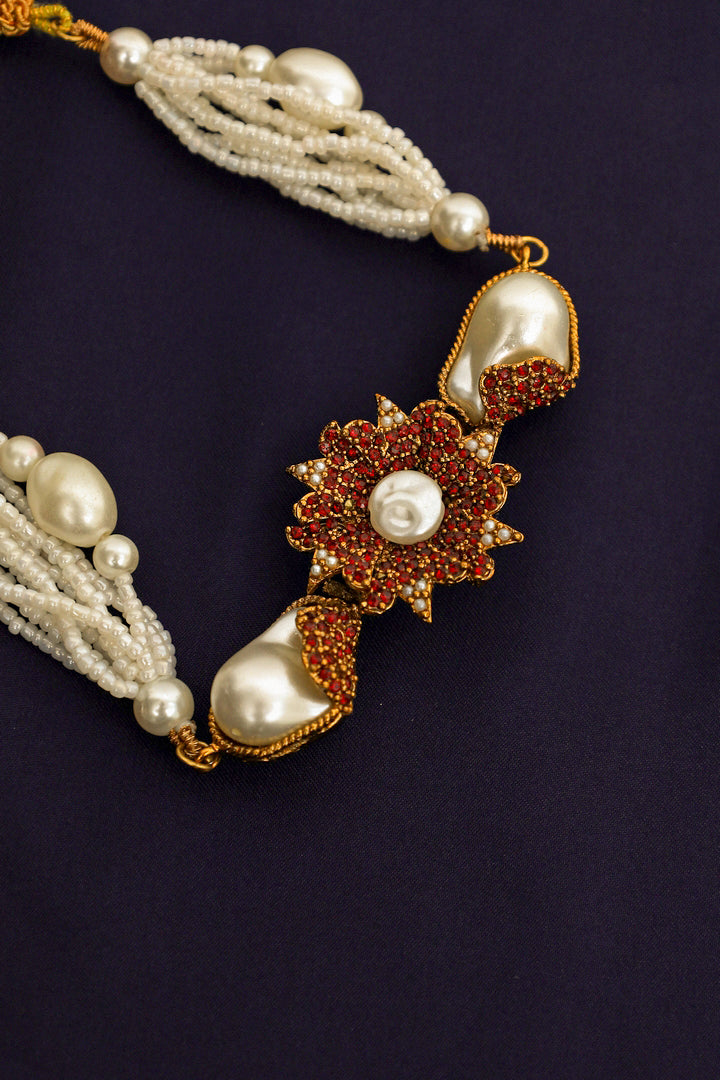 Pearl necklace with a decorative clasp .