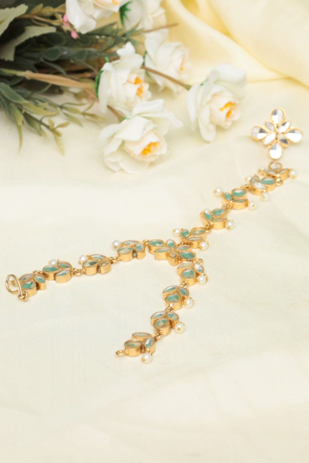 gold tone kundan haath phool hand harness for women