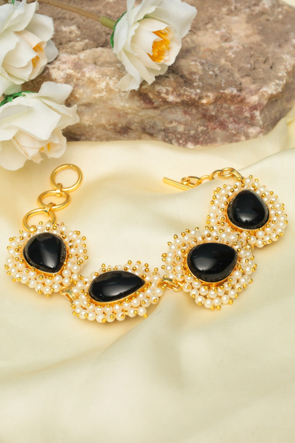 gold tone black stone and pearl cluster bracelet for women