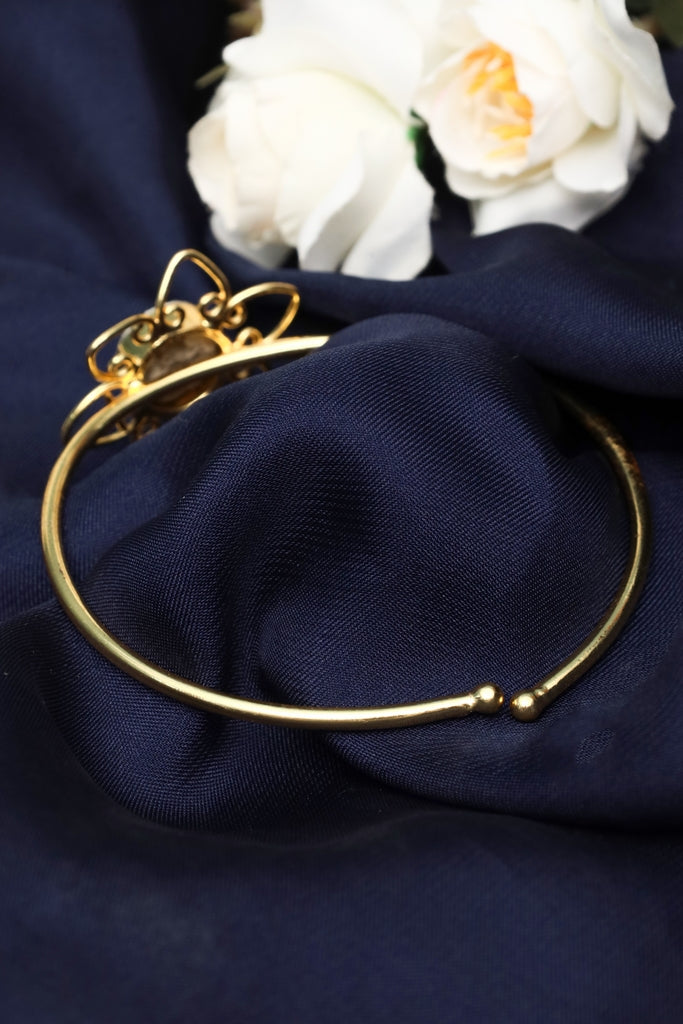 gold tone floral cuff bracelet with black and white marbled stone for women