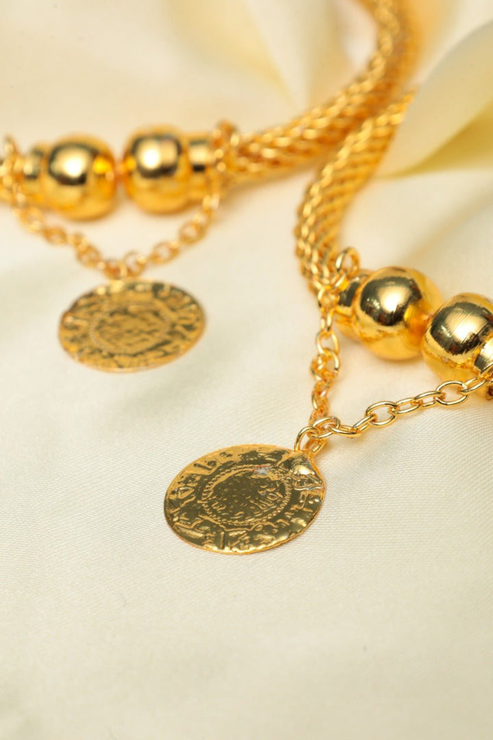 Gold - Tone Paired Twisted Bangle Bracelet with Hammered Coin Charm – Stackable Fashion Jewelry - Zehnaz.ae